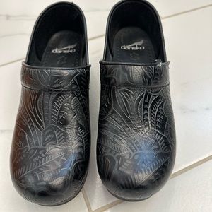 Leather Dansko clogs.